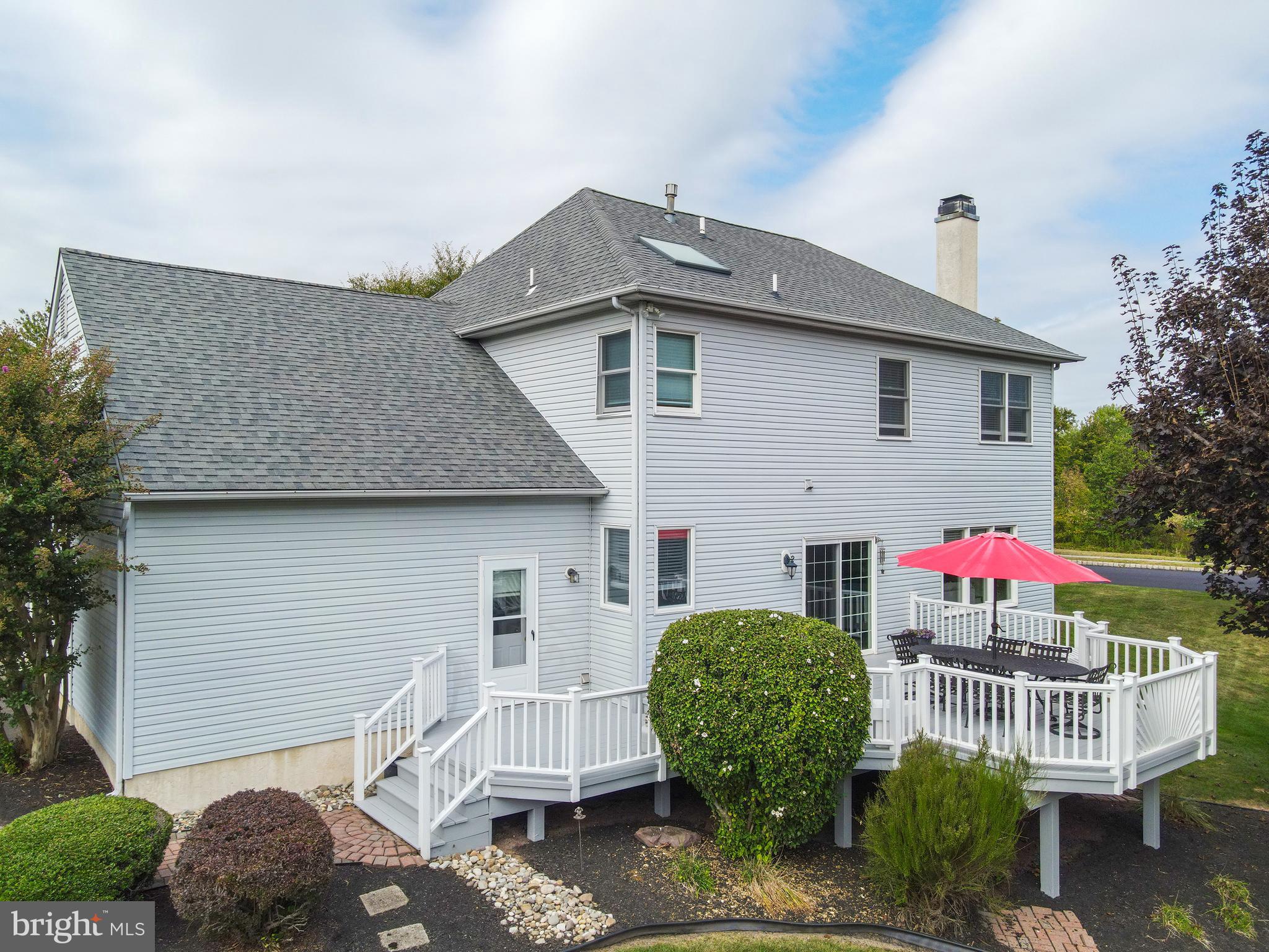 4925 Redfield Road Doylestown, PA 18902 - Photo 11 of 53 a front view of a house with yard and outdoor seating