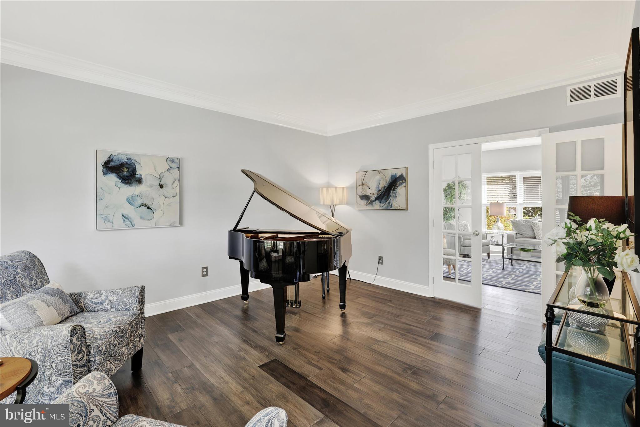4925 Redfield Road Doylestown, PA 18902 - Photo 19 of 53 a living room with furniture and a wooden floor