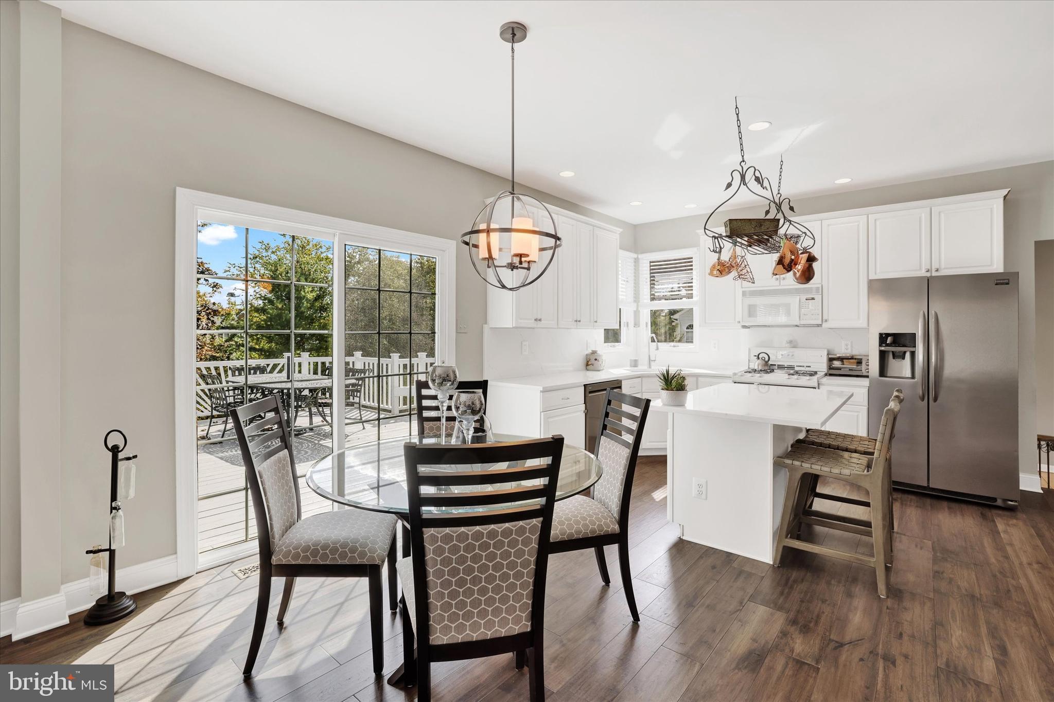4925 Redfield Road Doylestown, PA 18902 - Photo 24 of 53 a dining area with furniture a chandelier and wooden floor