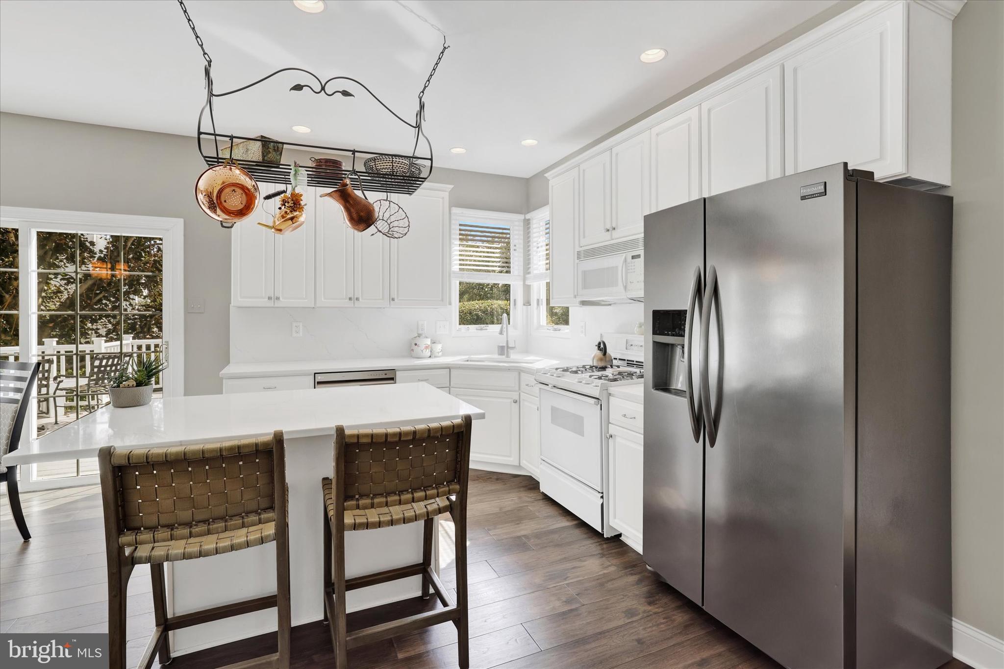 4925 Redfield Road Doylestown, PA 18902 - Photo 28 of 53 a kitchen with refrigerator cabinets and a table