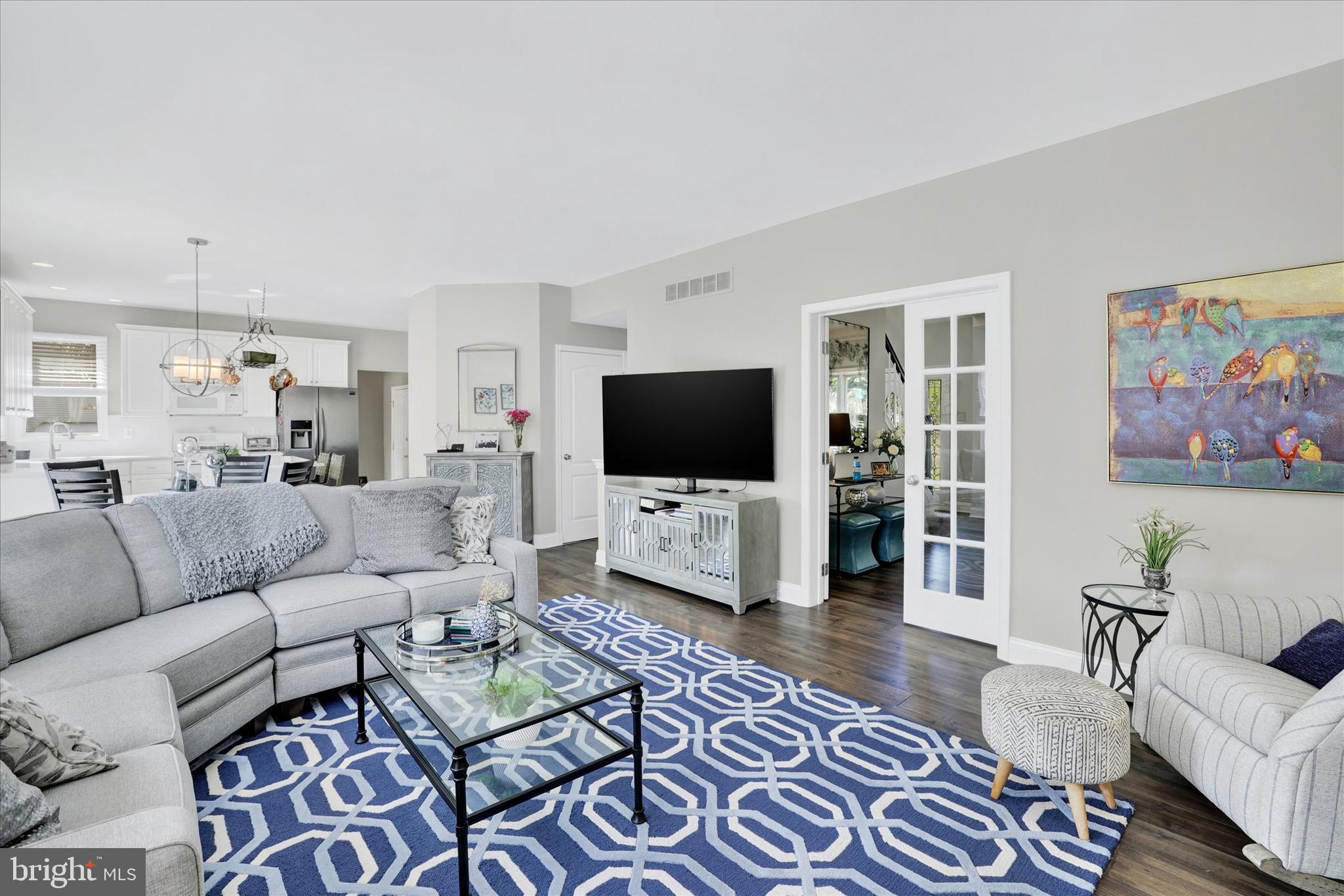 4925 Redfield Road Doylestown, PA 18902 - Photo 32 of 53 a living room with furniture and a flat screen tv