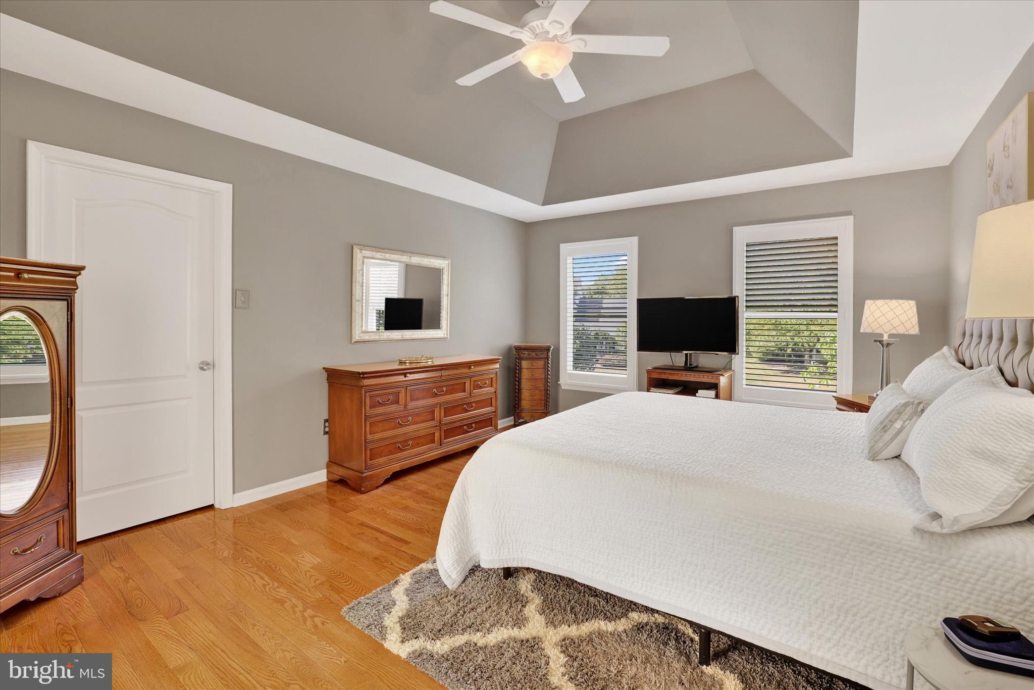 4925 Redfield Road Doylestown, PA 18902 - Photo 37 of 53 a bedroom with a bed and a flat tv screen on dresser