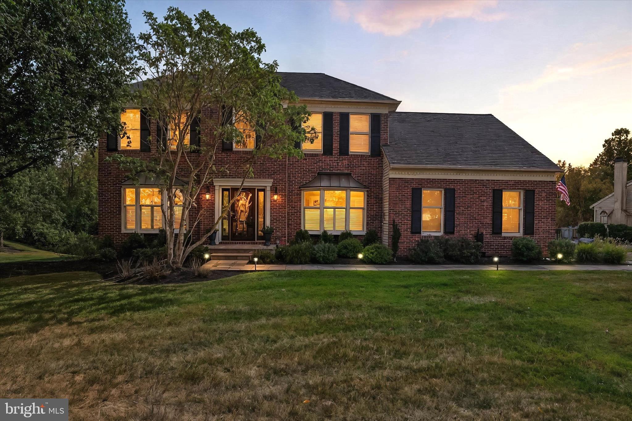 4925 Redfield Road Doylestown, PA 18902 - Photo 4 of 53 a view of a brick house with a yard