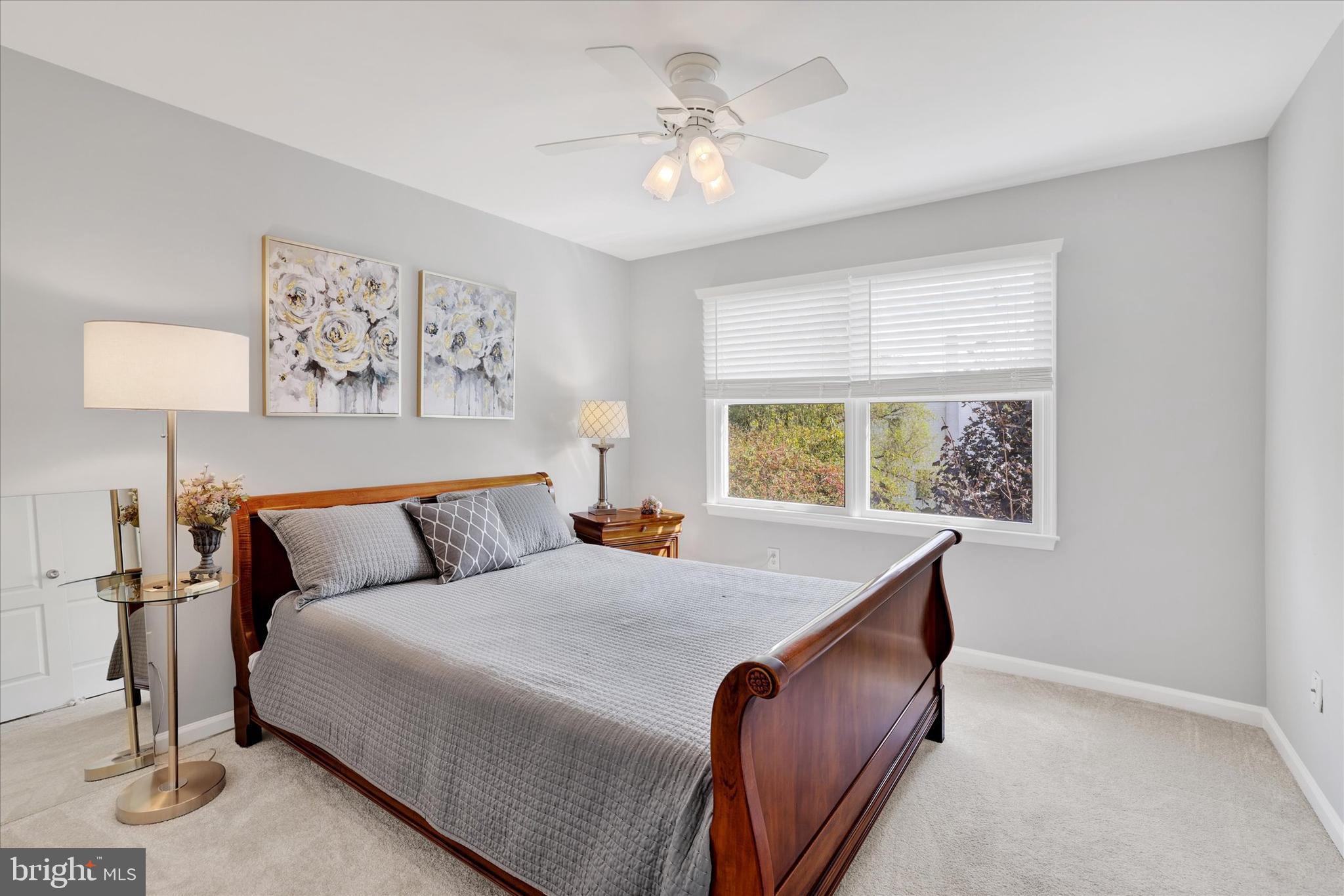 4925 Redfield Road Doylestown, PA 18902 - Photo 43 of 53 a bed room with a bed and a chandelier