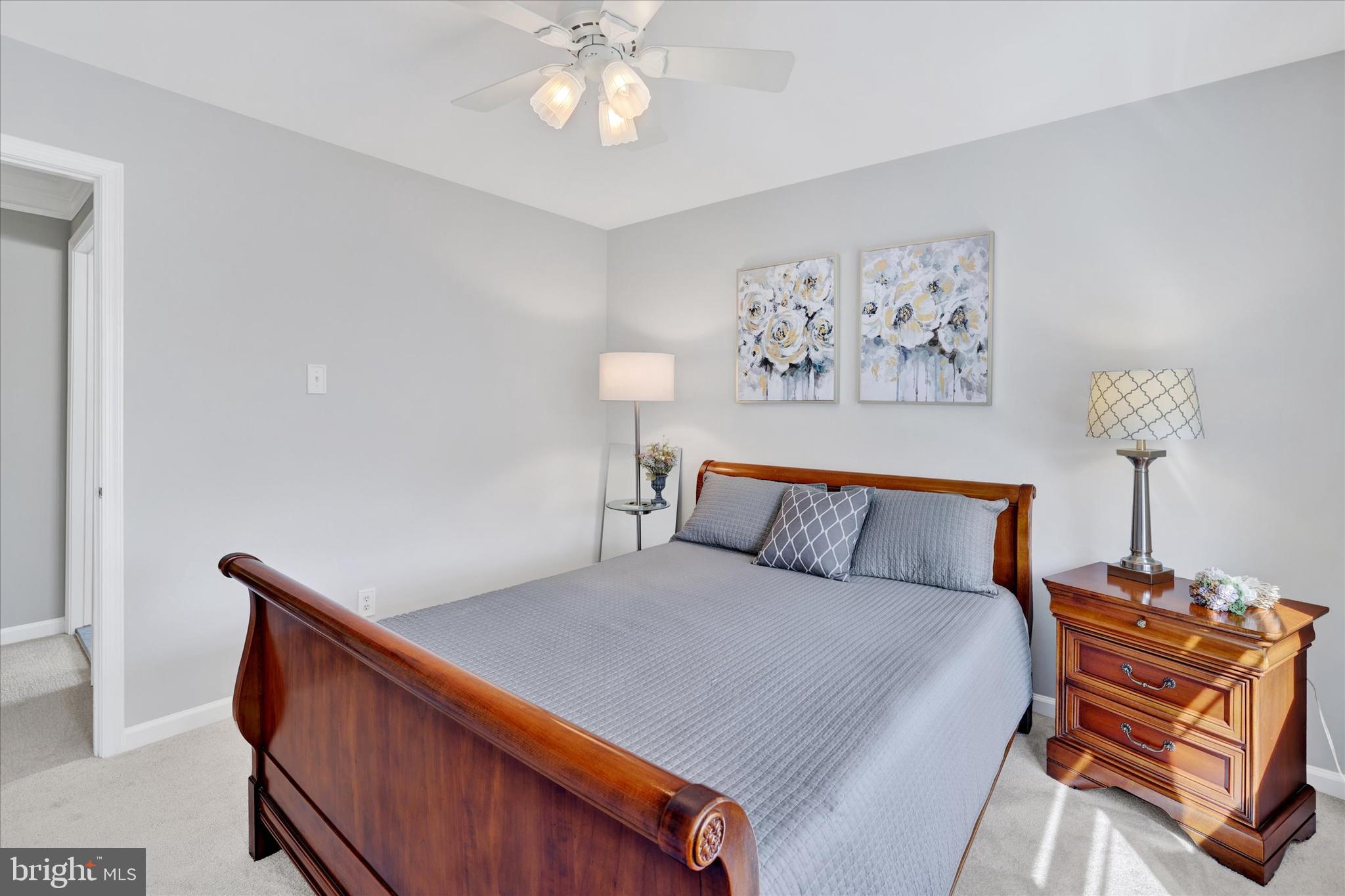 4925 Redfield Road Doylestown, PA 18902 - Photo 44 of 53 a bed room with a bed and a chandelier