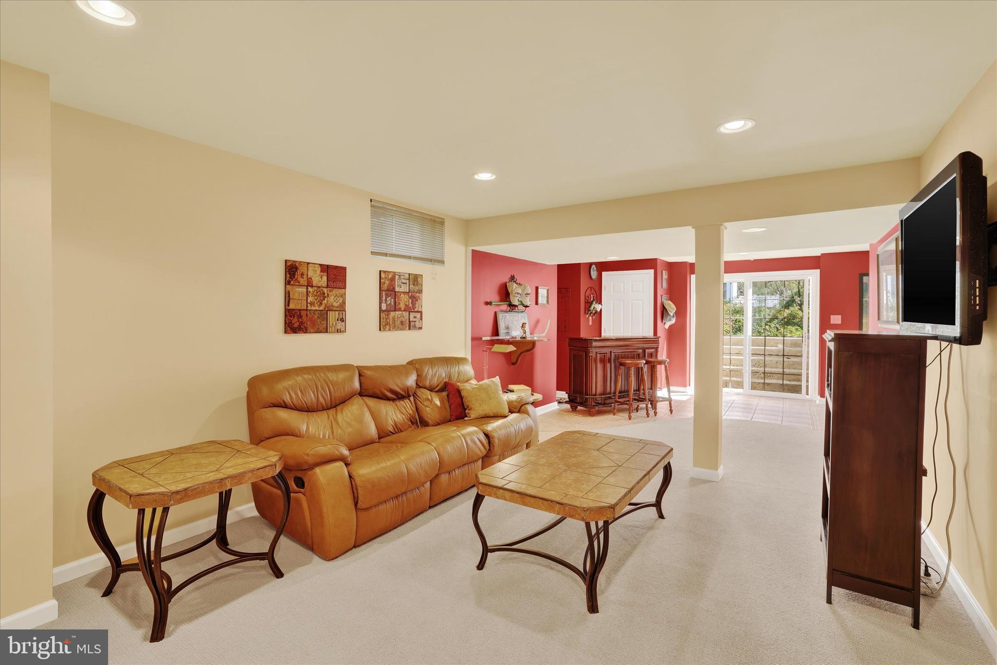 4925 Redfield Road Doylestown, PA 18902 - Photo 49 of 53 a living room with furniture and a flat screen tv