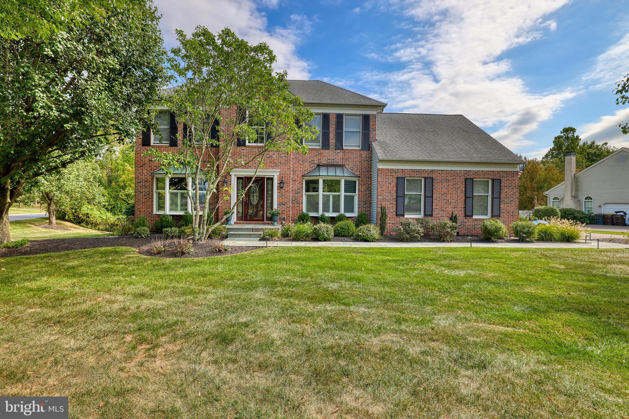 4925 Redfield Road Doylestown, PA 18902 - Photo 5 of 53 a front view of a house with a garden