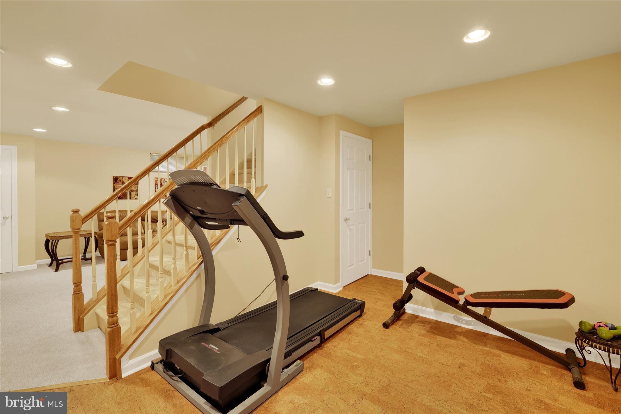 4925 Redfield Road Doylestown, PA 18902 - Photo 52 of 53 a room with gym equipment and wooden floor