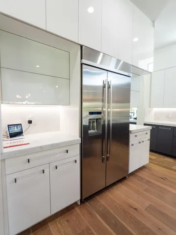 a utility room with multiple dryer and washer