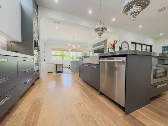 a spacious bathroom with a granite countertop sink a toilet and shower