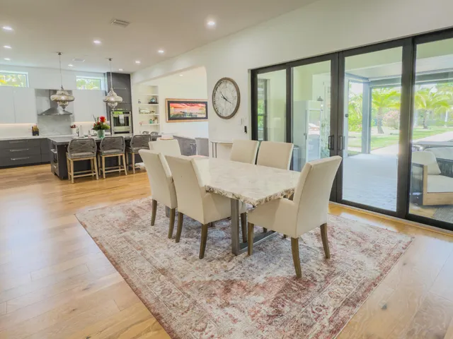 a kitchen with a refrigerator and a stove