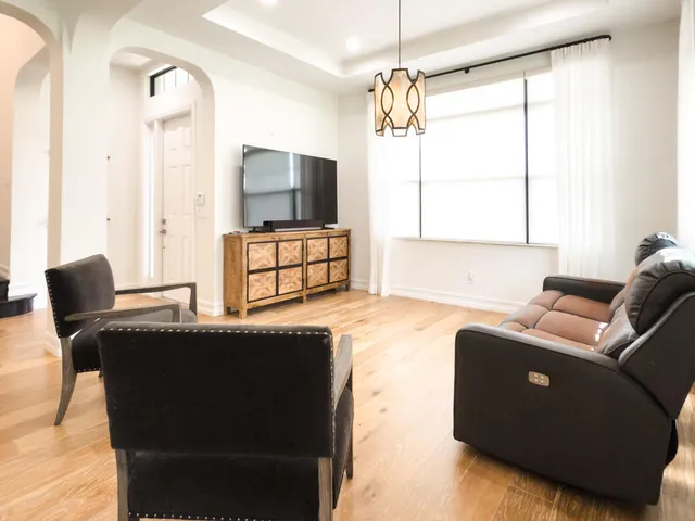 a bathroom with a granite countertop toilet sink and mirror