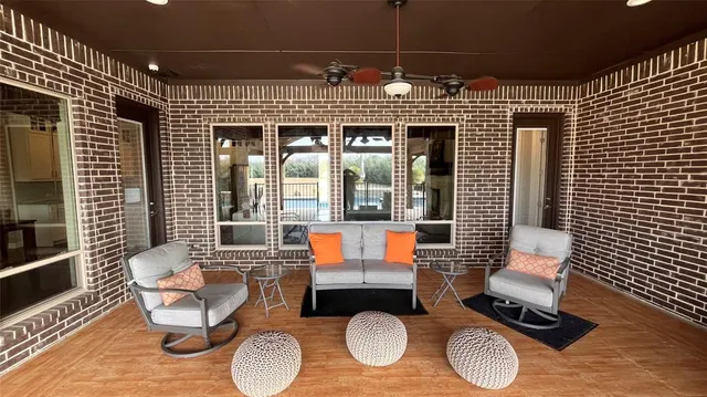 a dining room with furniture and wooden floor