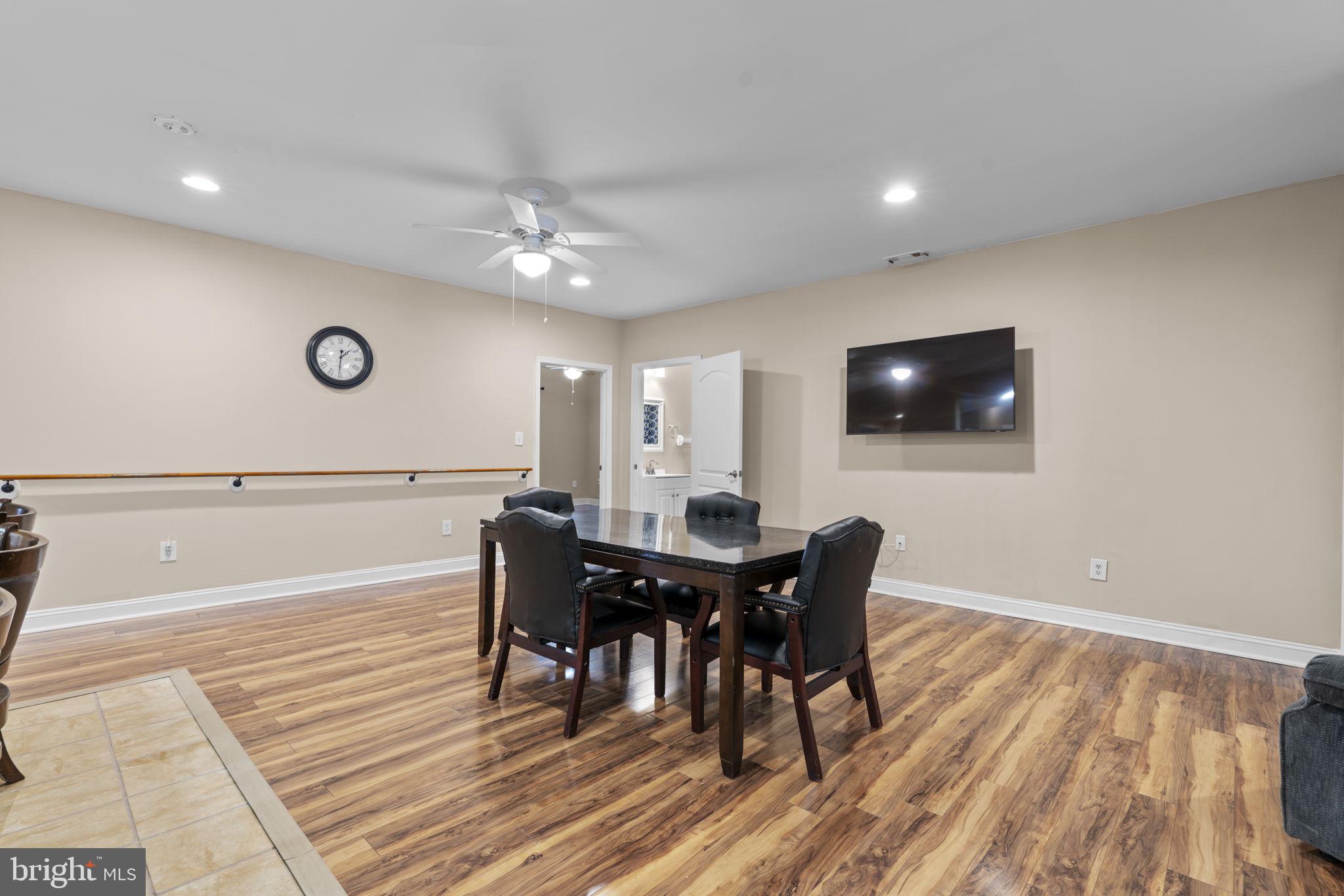 8024 Solley Road Glen Burnie, MD 21060 - Photo 63 of 83 a view of a dining room with furniture and wooden floor