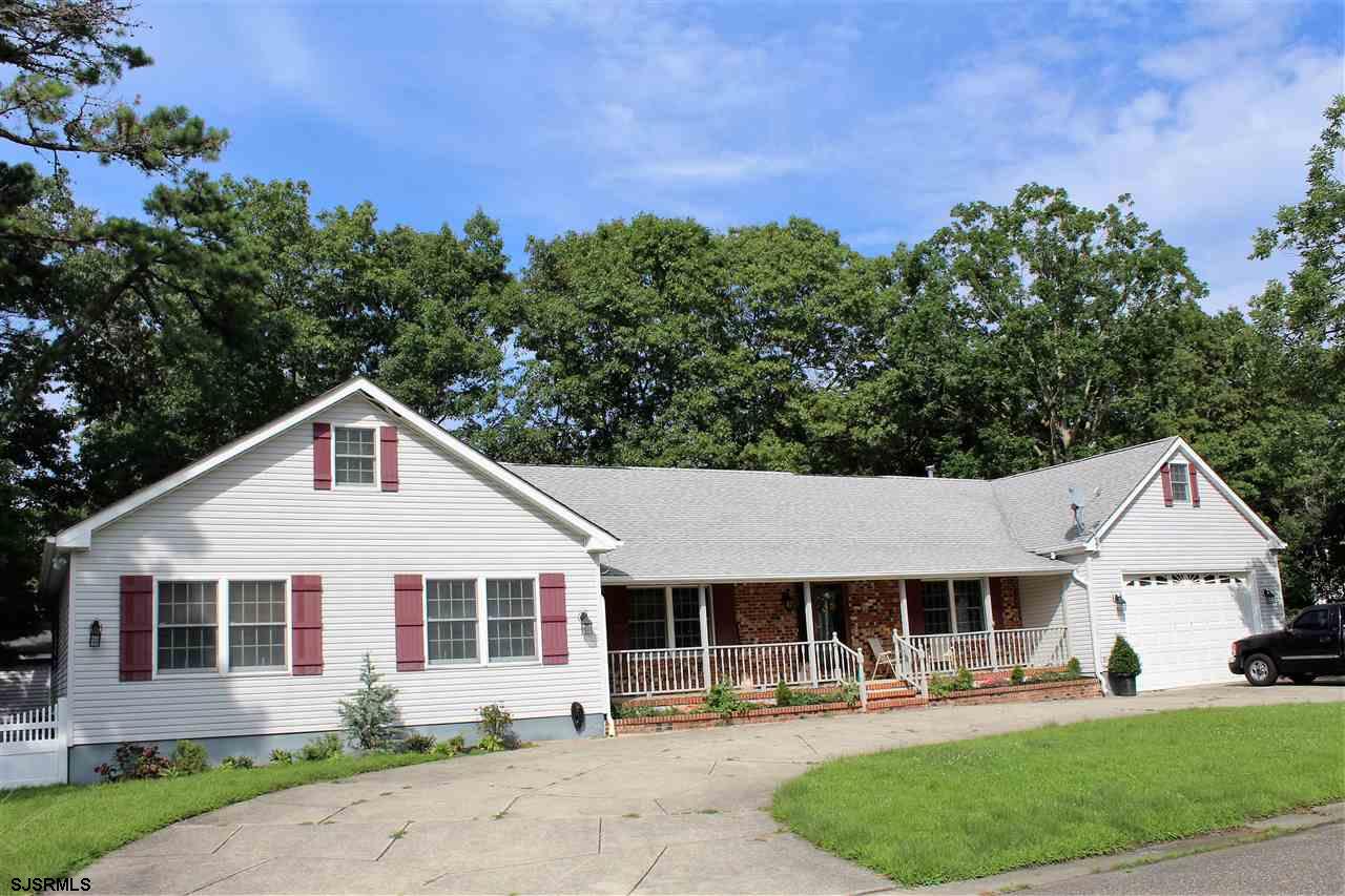 808 Chelsea Road Absecon, NJ 08201 - Photo 1 of 1 a front view of a house with a yard and trees