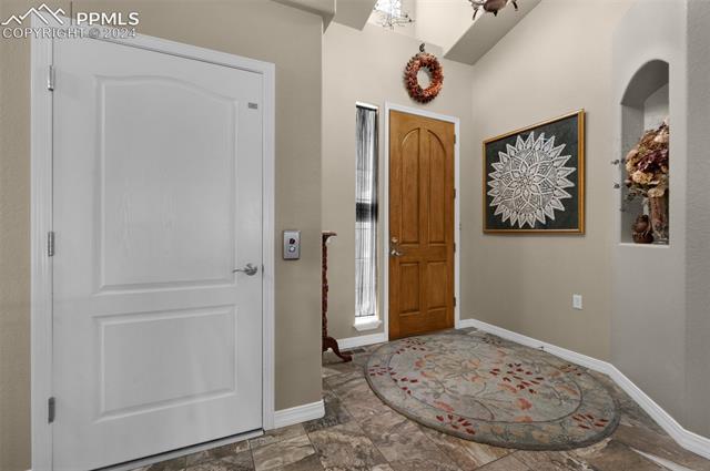 533 Talus Road Monument, CO 80132 - Photo 12 of 46 Foyer entrance with lofted ceiling