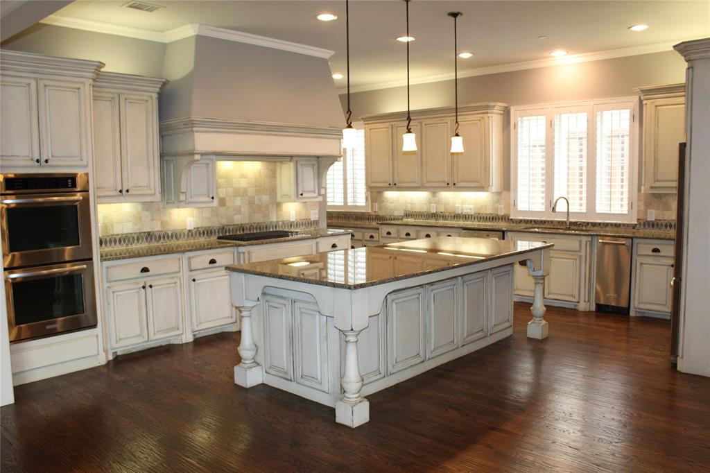 1835 Olney Drive Allen, TX 75013 - Photo 4 of 29 a kitchen with stainless steel appliances granite countertop a sink a stove and a refrigerator