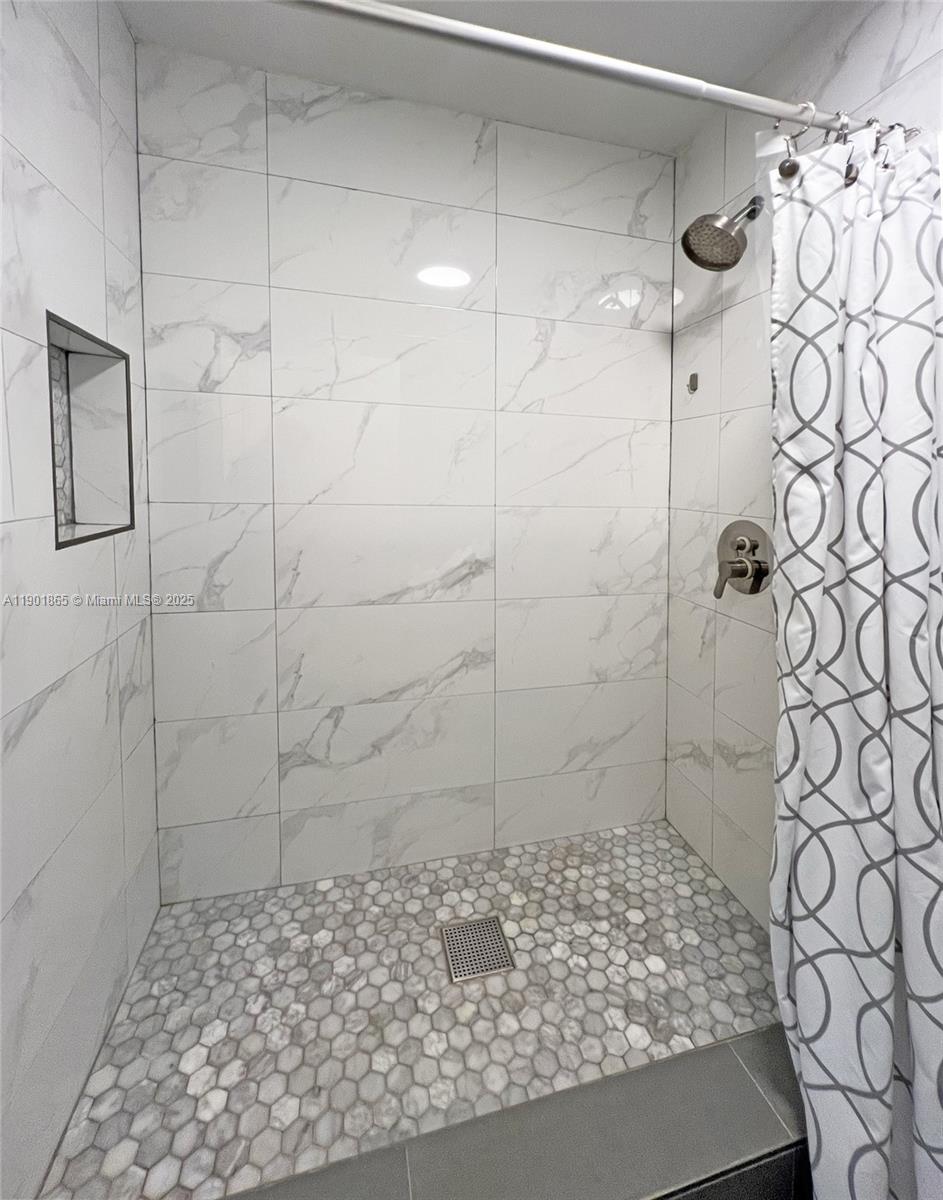14015 Southwest 91st Terrace, Unit 14015 Miami, FL 33186 - Photo 9 of 20 a bathroom with a shower