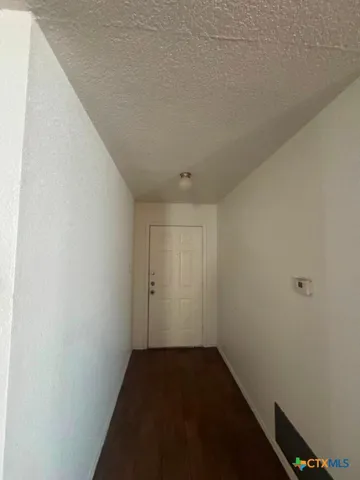 a bathroom with a sink toilet a mirror and bathtub