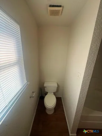 a view of empty room with a fireplace