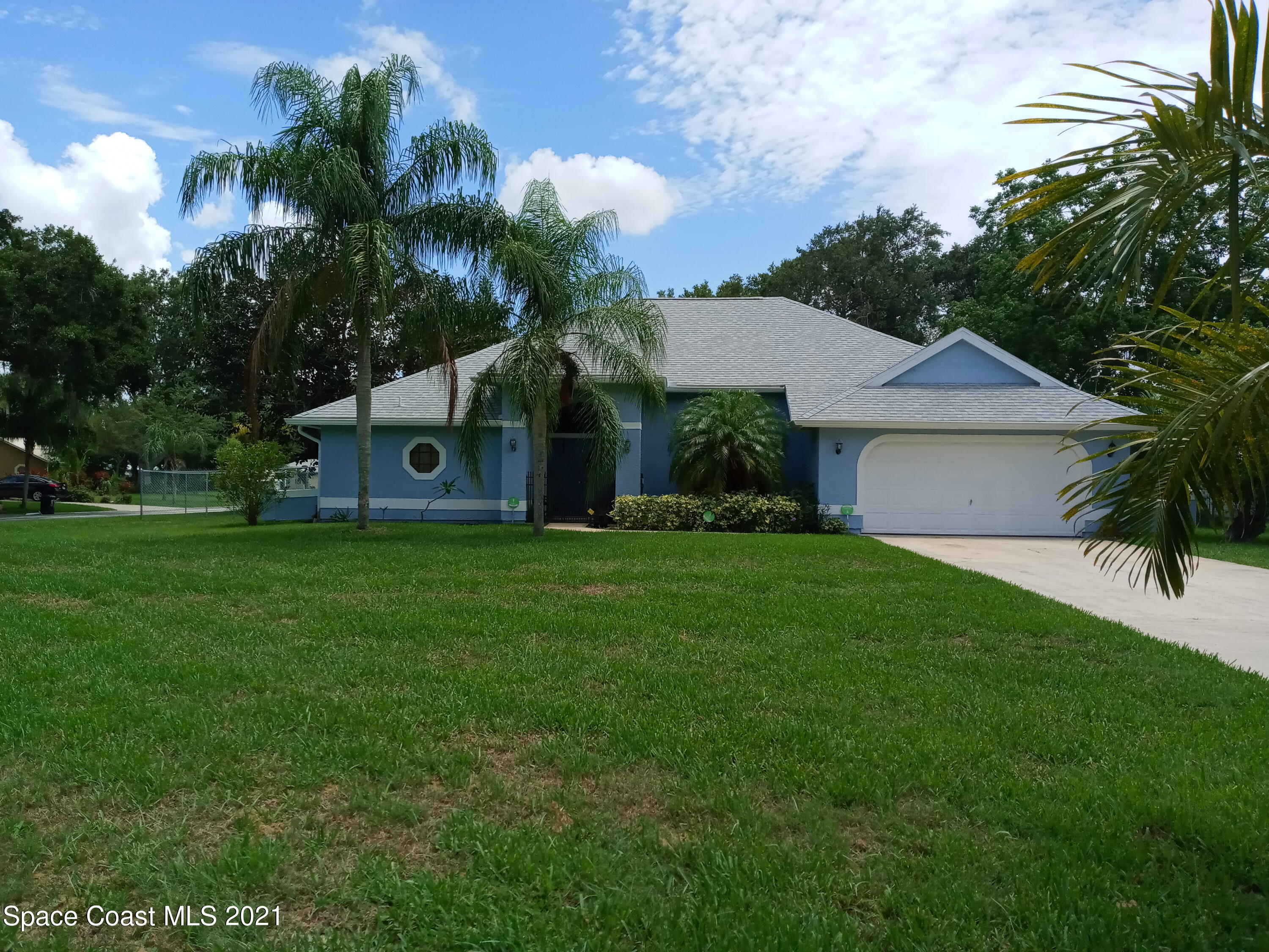 798 Riviera Drive Northeast Palm Bay, FL 32905 - Photo 1 of 7 a front view of house with yard and green space