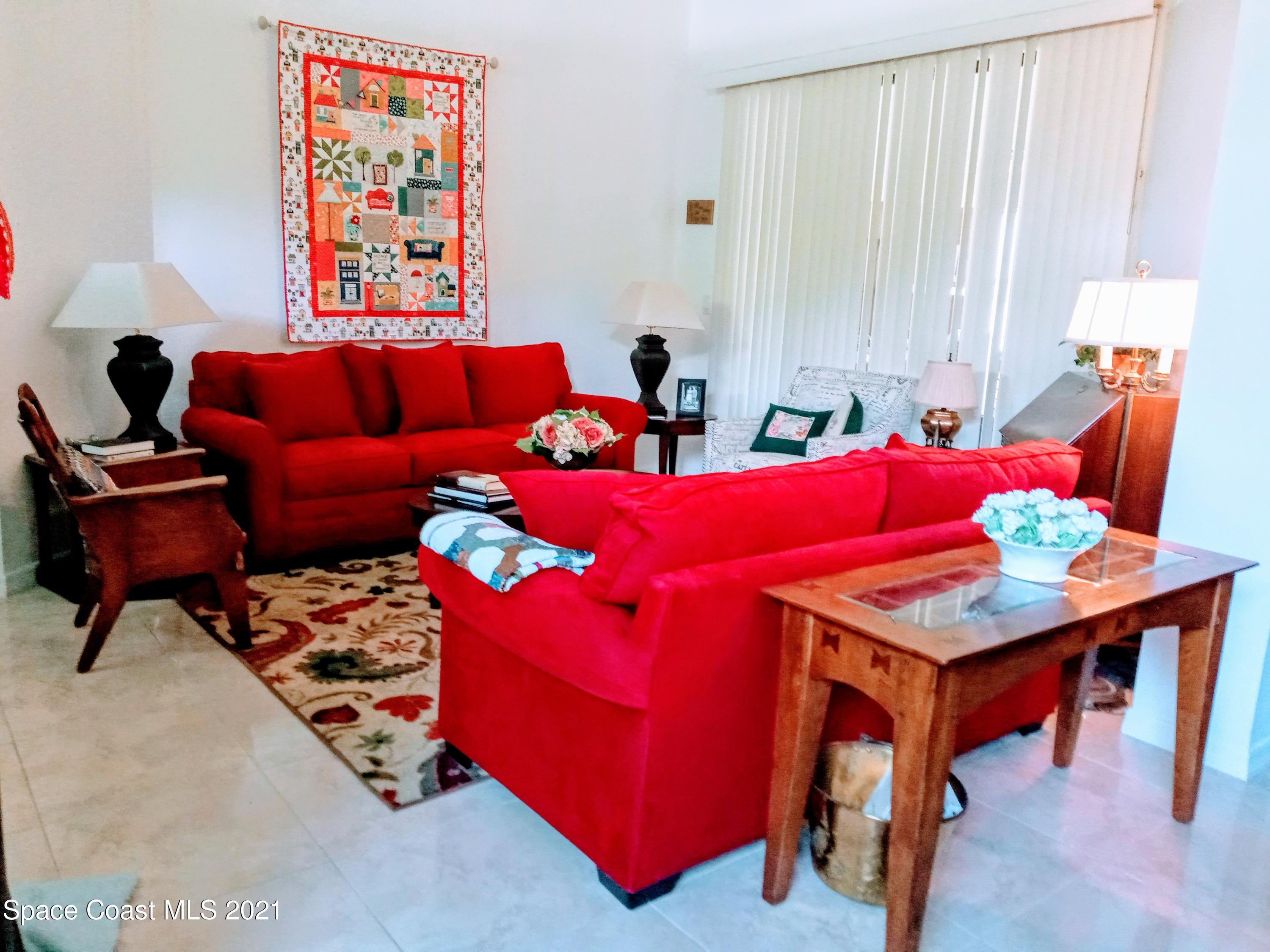 798 Riviera Drive Northeast Palm Bay, FL 32905 - Photo 2 of 7 a living room with furniture and next to a window