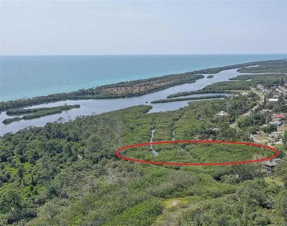 a view of a lake with a yard