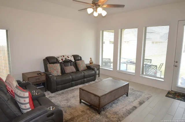 a livingroom with toys and a chandelier