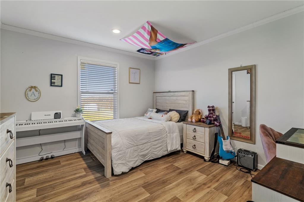 1350 Beham Ridge Road West Alexander, PA 15376 - Photo 22 of 48 a bedroom with a bed and a chandelier