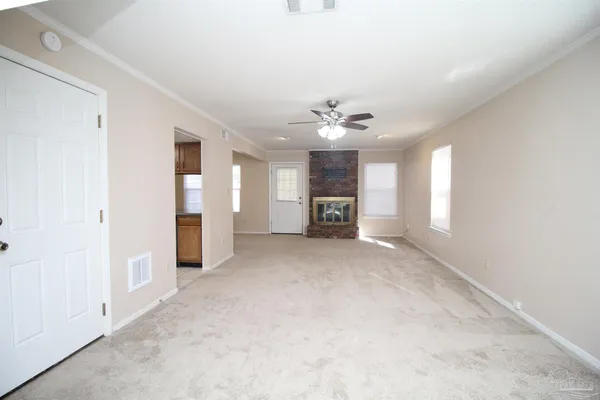 a view of a livingroom with a kitchen