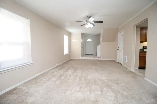 a view of an empty room with a window