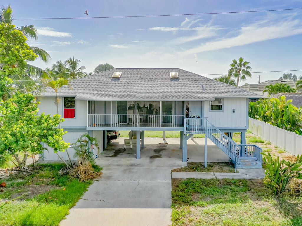 a view of house with swimming pool outdoor seating area and entertaining space