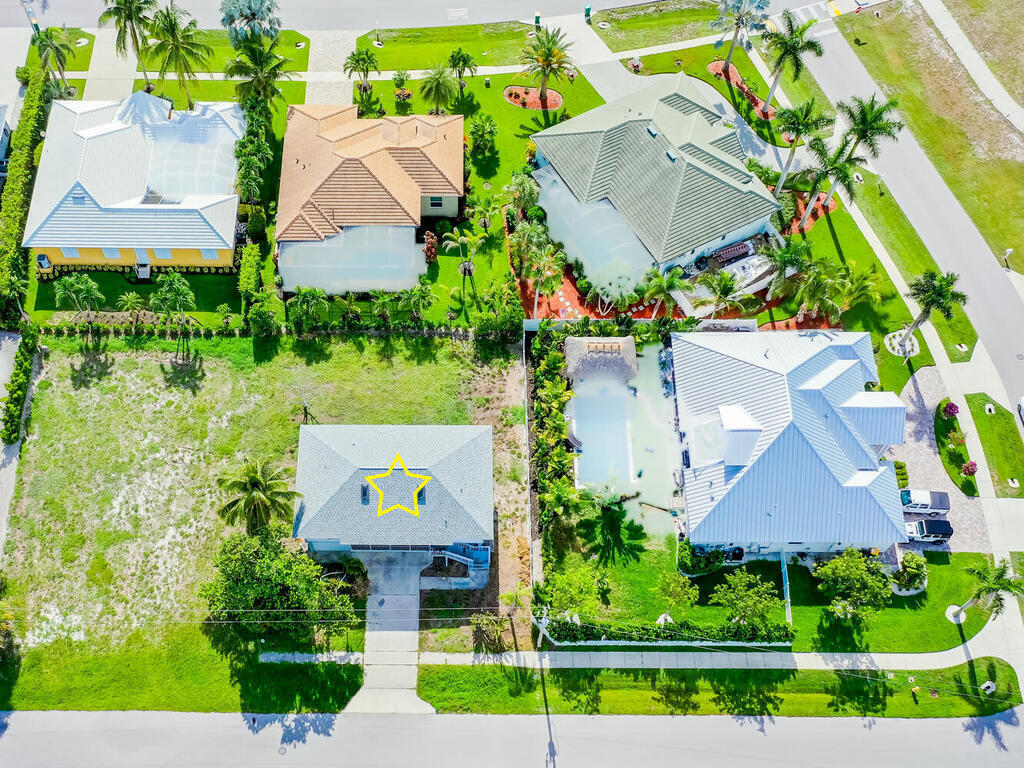 185 Delbrook Way Marco Island, FL 34145 - Photo 2 of 10 an aerial view of a house with a garden and plants