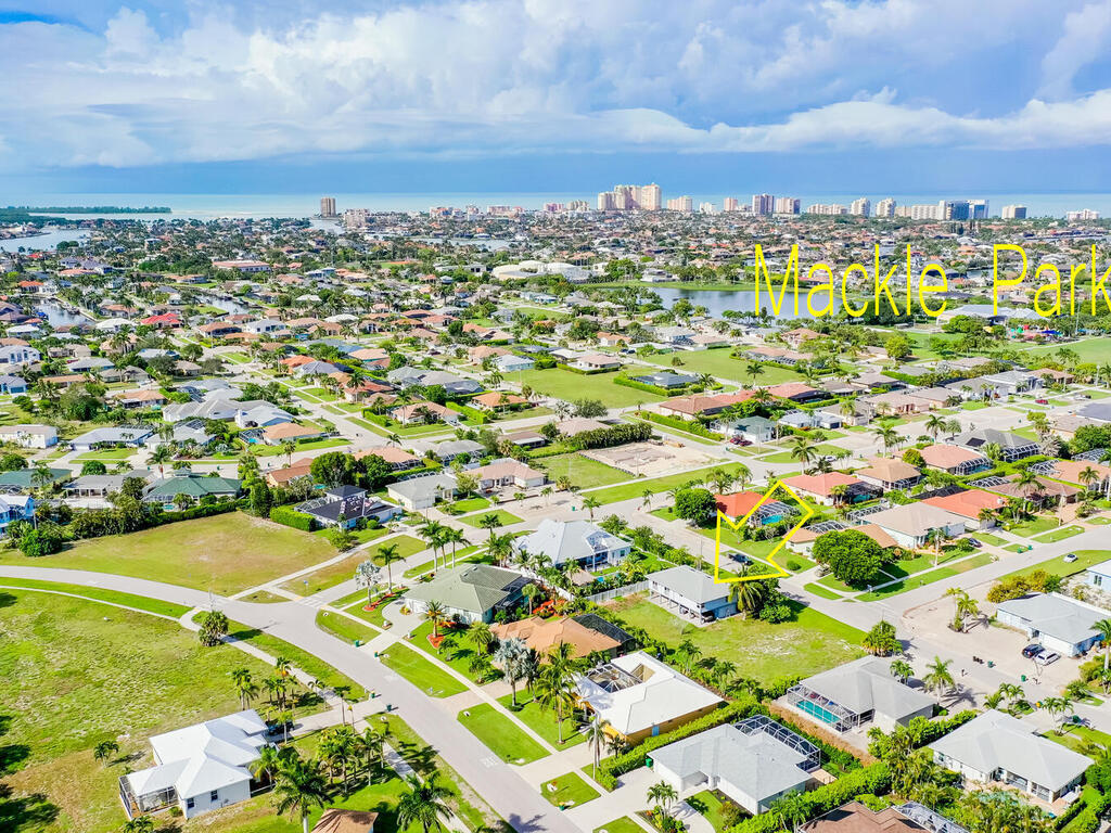 185 Delbrook Way Marco Island, FL 34145 - Photo 5 of 10 an aerial view of residential houses with outdoor space and trees