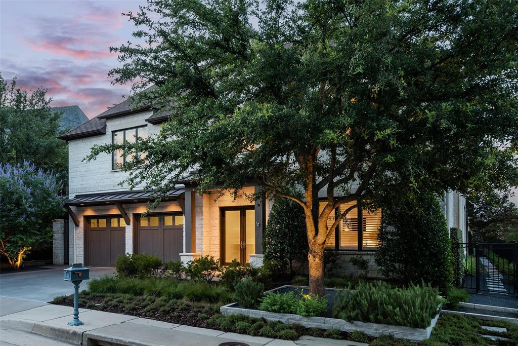 front view of a house with a tree