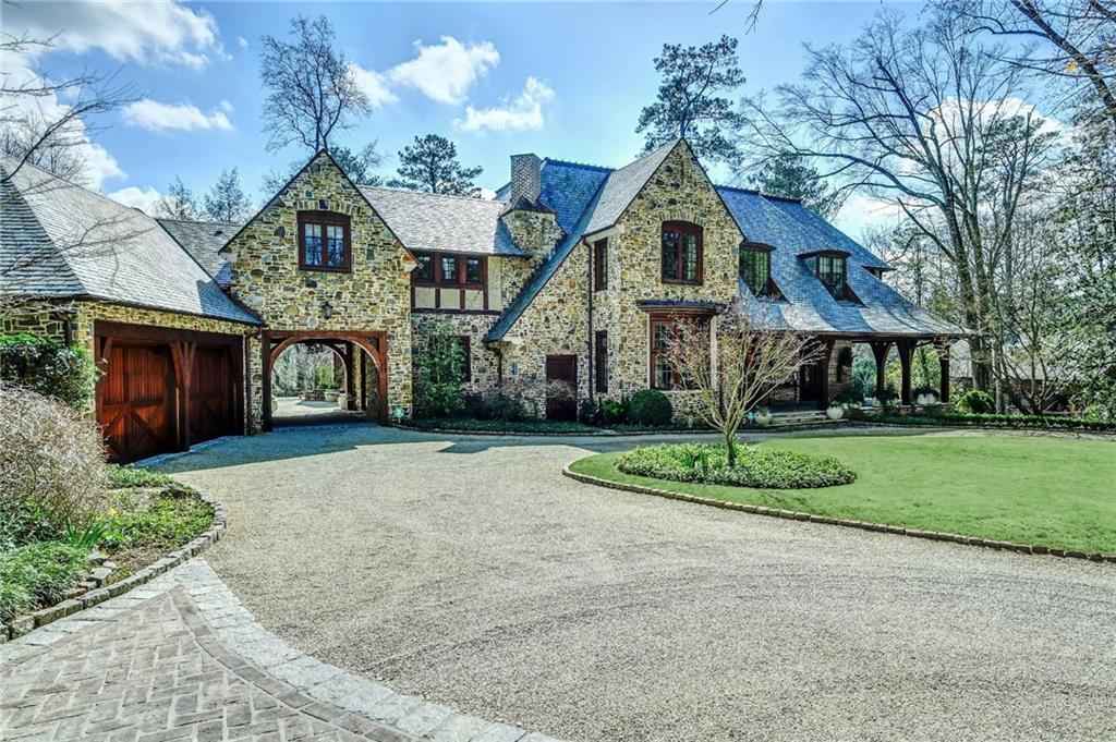 2561 Bohler Road Northwest Atlanta, GA 30327 - Photo 1 of 1 a front view of a house with a yard and garage