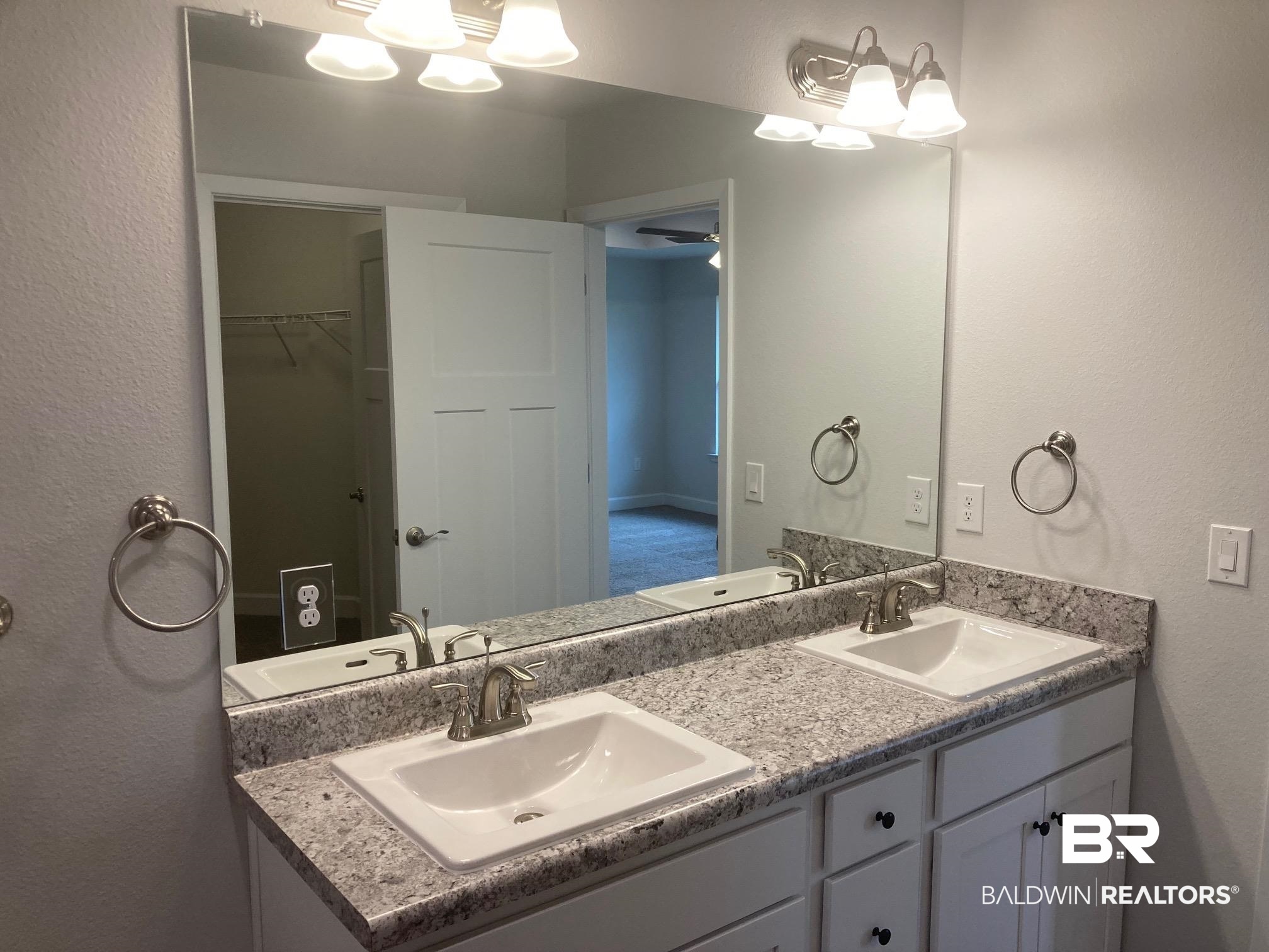 629 Revere Street Foley, AL 36535 - Photo 23 of 30 Bathroom featuring ceiling fan and vanity