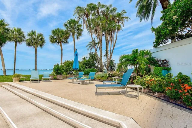 a view of a swimming pool and lounge chairs