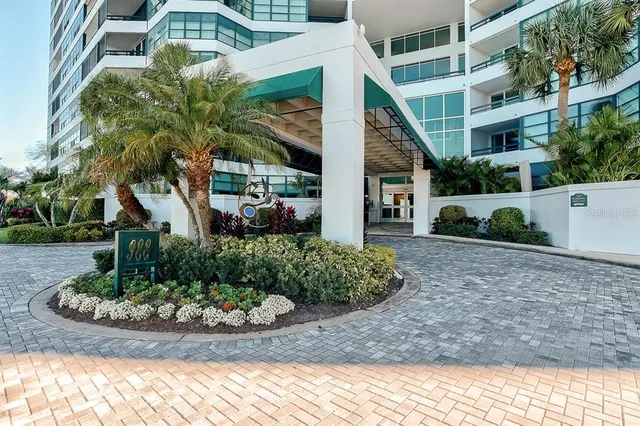 a kitchen with stainless steel appliances granite countertop a sink and a stove