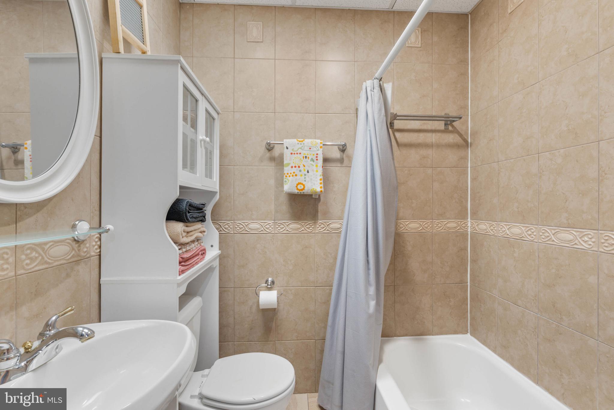 105 South 2nd Street Philadelphia, PA 19106 - Photo 27 of 54 a white toilet sitting next to a bathroom sink