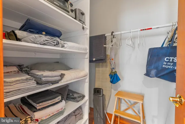 a kitchen with stainless steel appliances granite countertop a stove refrigerator sink and cabinets