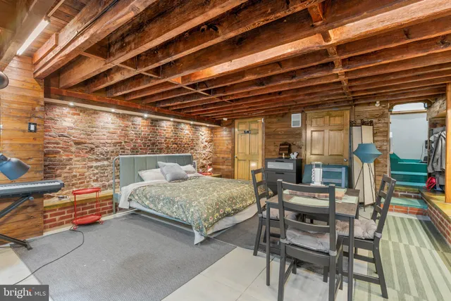 a bedroom with furniture and a chandelier