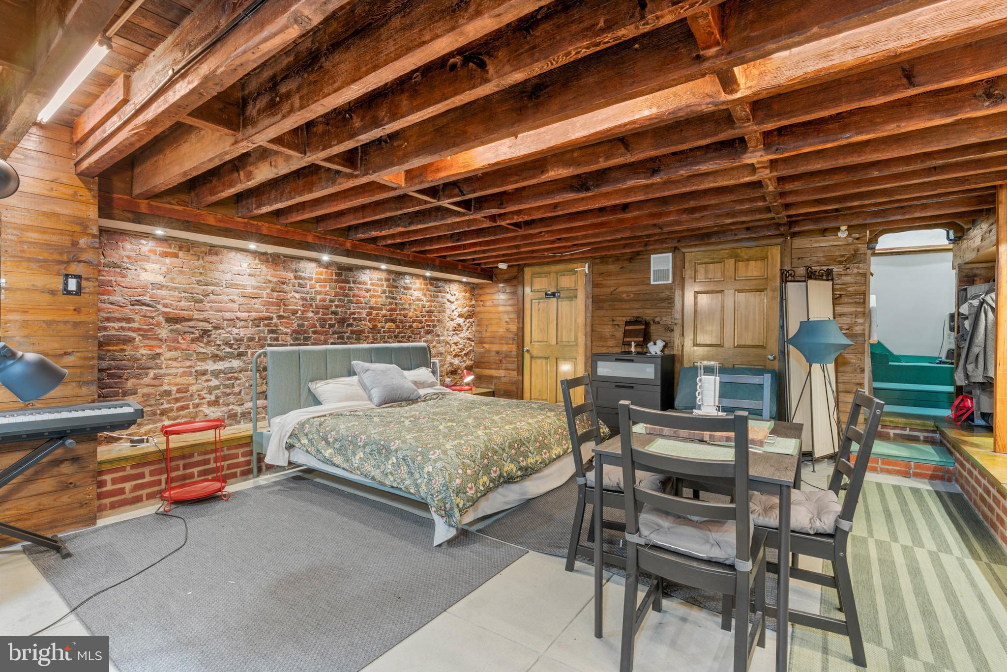 105 South 2nd Street Philadelphia, PA 19106 - Photo 3 of 54 a bedroom with furniture and a chandelier