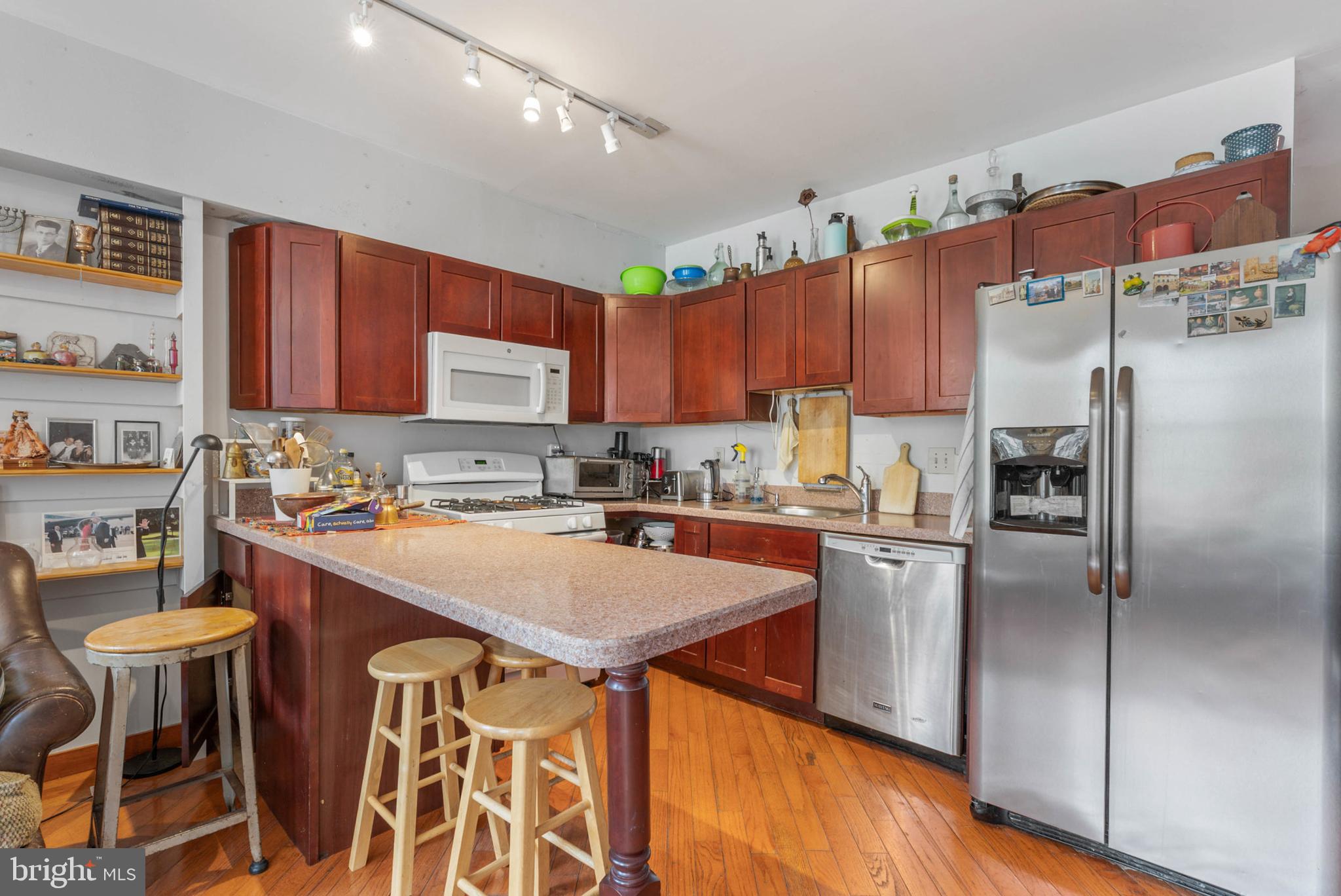 105 South 2nd Street Philadelphia, PA 19106 - Photo 31 of 54 a kitchen with stainless steel appliances granite countertop a stove refrigerator sink and cabinets