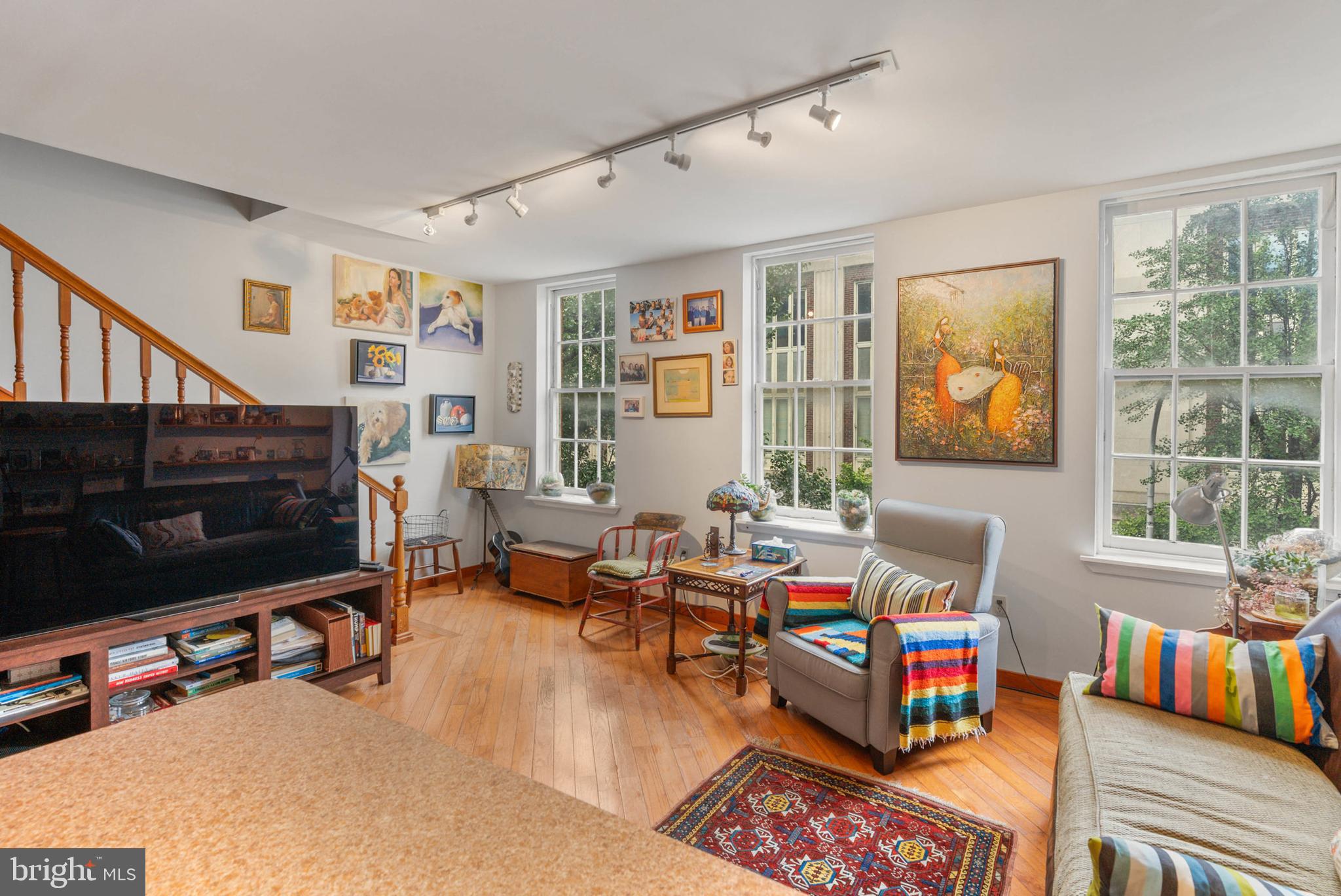 105 South 2nd Street Philadelphia, PA 19106 - Photo 34 of 54 a living room with furniture a flat screen tv and a window