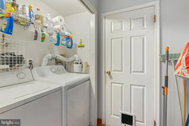 a bed room with a bed and a flat tv screen on dresser