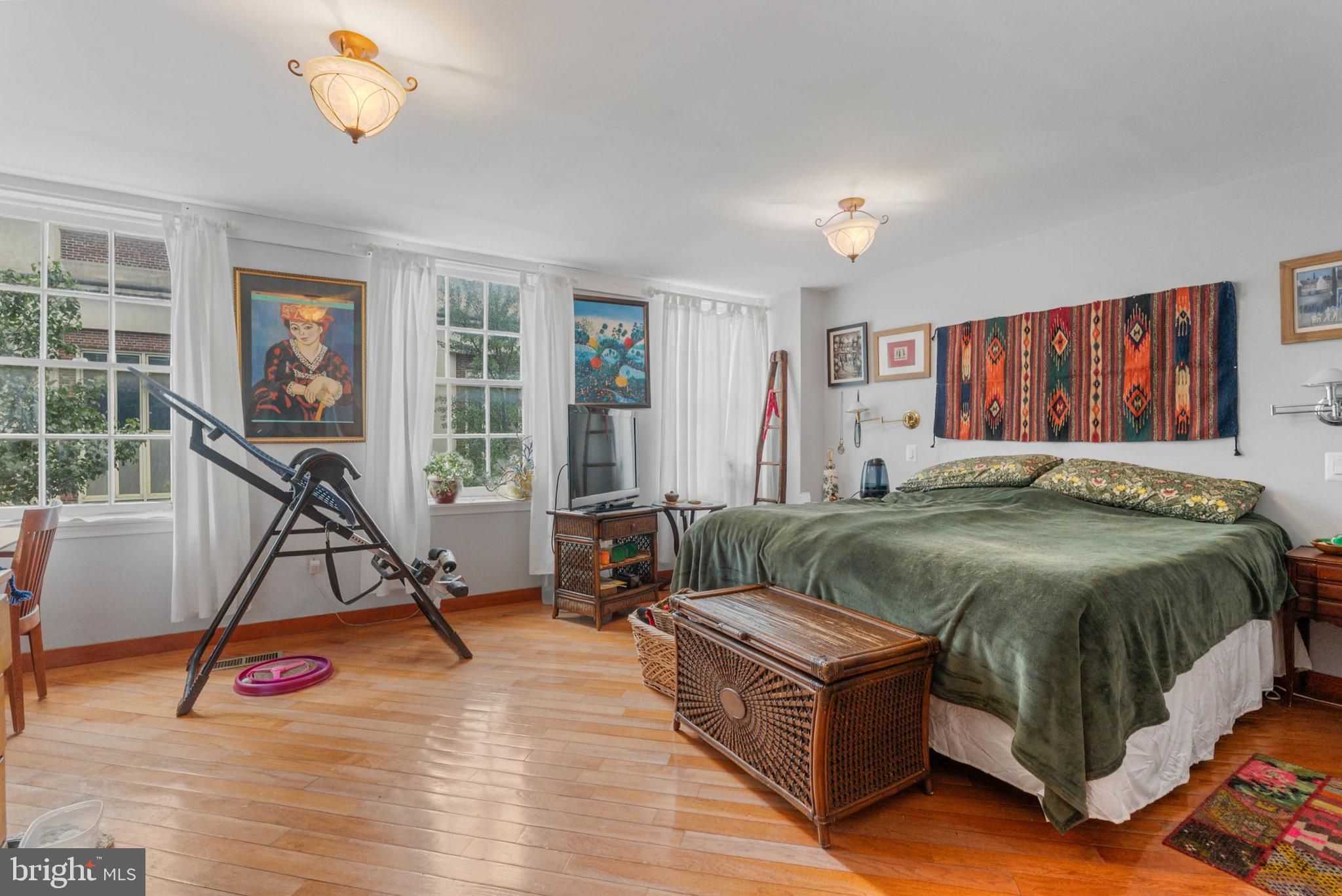 105 South 2nd Street Philadelphia, PA 19106 - Photo 39 of 54 a bed sitting in a bedroom next to a window