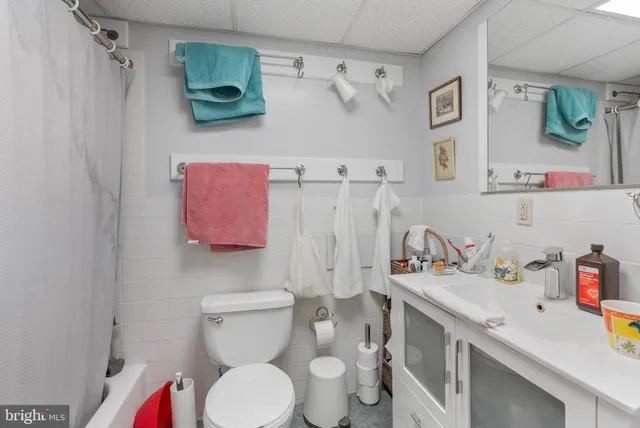 a bedroom with furniture and a book shelf