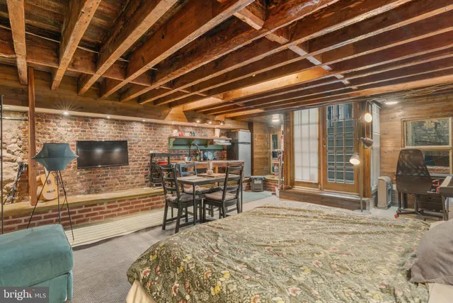 a view of a room with wooden furniture
