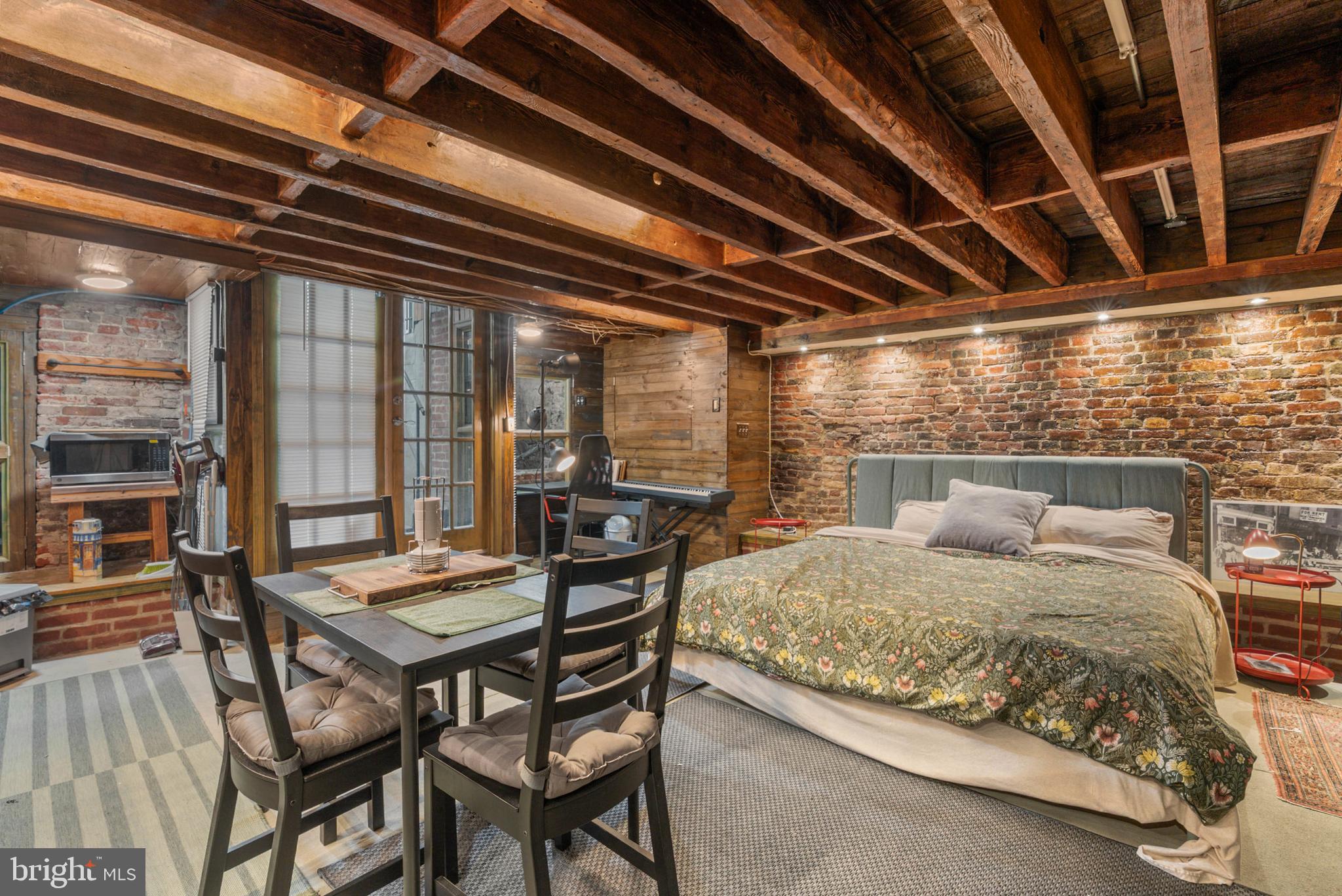 105 South 2nd Street Philadelphia, PA 19106 - Photo 6 of 54 a bedroom with a bed a table and chairs